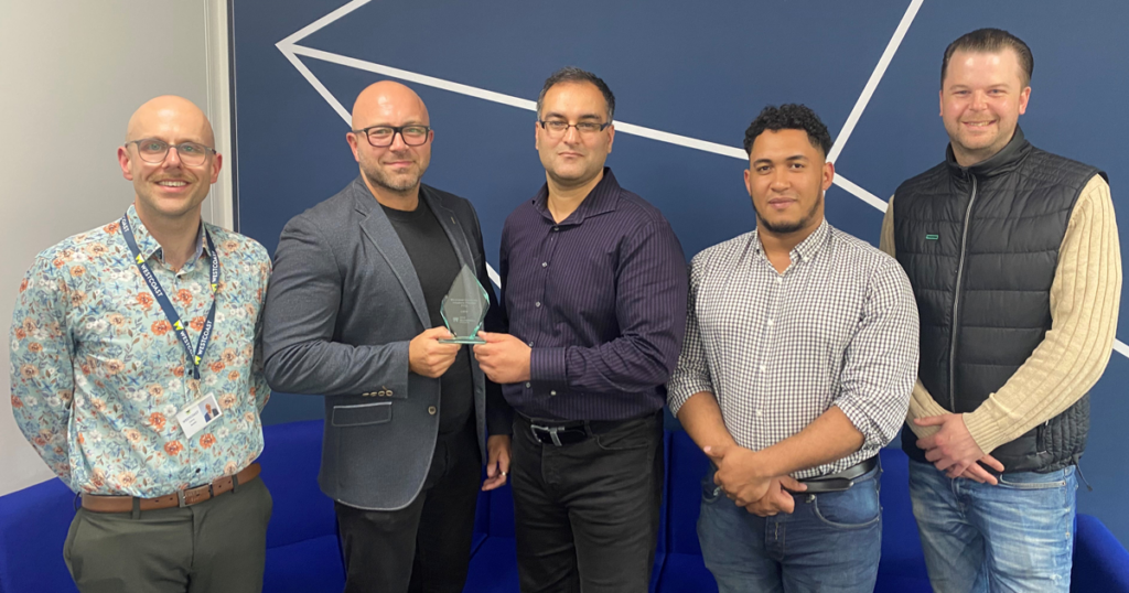 The exchange of the award, from left to right: Larry Smith, XaaS Sales Manager, Technology Solutions, Westcoast Limited; Simon Boyce, Account Manager, CBTS UK Sales; Omar Raja, Program Manager, CBTS Global Sales Desk; Ray Thompson, HPE GreenLake Business Development Manager, Westcoast Limited; and Alex Jones, HPE Business Development Manager, Westcoast Limited